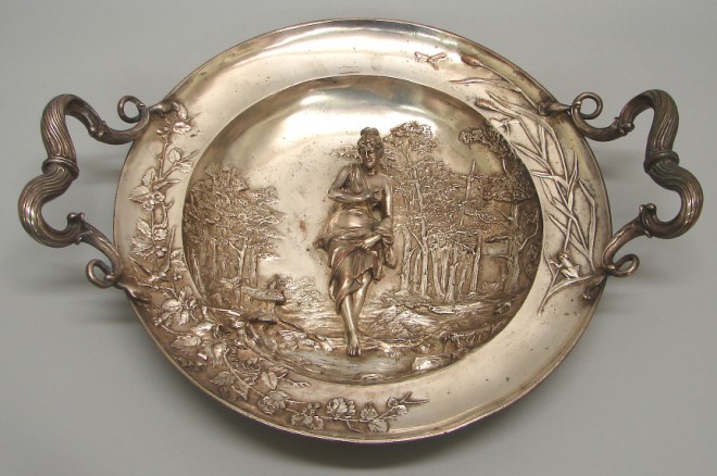 Appraisal: Bronze plate charger features relief decoration with classical figure in