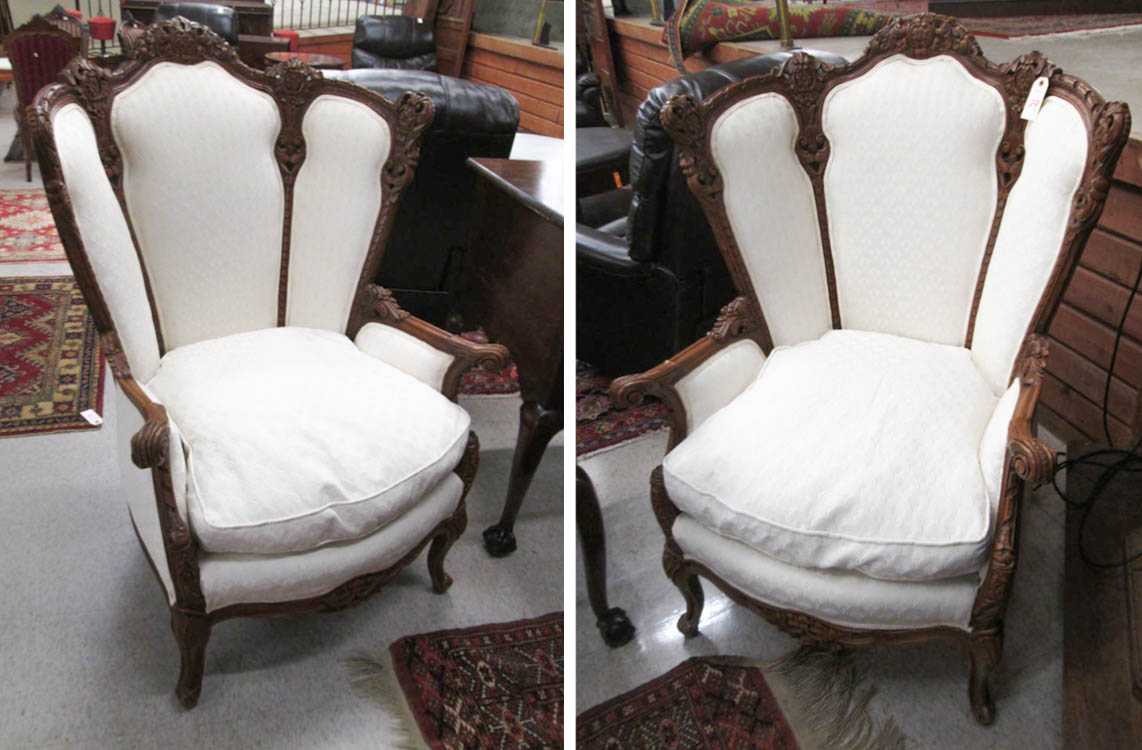 Appraisal: A PAIR OF CARVED AND UPHOLSTERED ARMCHAIRS American second quarter