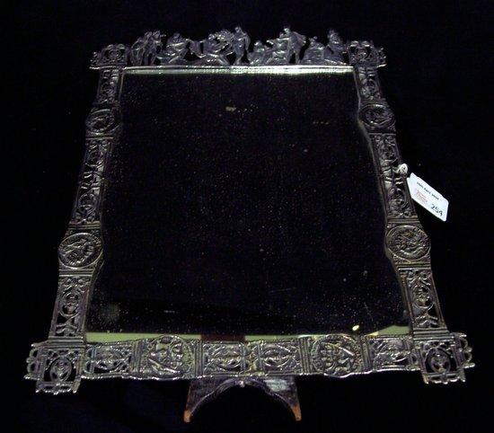 Appraisal: An easel mirror stamped Detler with cornice of Classical figures