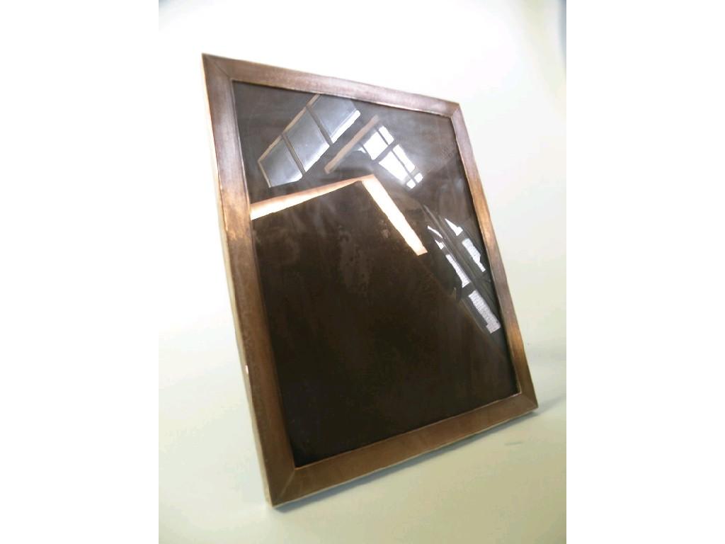 Appraisal: A rectangular silver photograph frame with an engine turned border