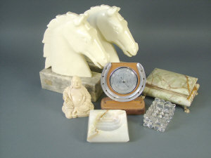 Appraisal: A pair of polished alabaster horses head bookends an alabaster