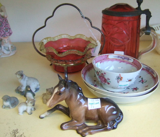 Appraisal: A cranberry glass lidded tankard with pewter mounts a cranberry