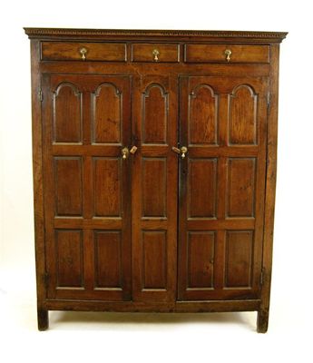 Appraisal: An early th century oak cupboard the dentil moulded cornice