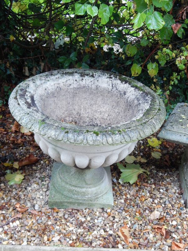 Appraisal: A large composition garden urn with a shaped border lobed