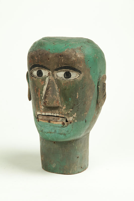 Appraisal: VENTRILOQUIST HEAD American late th century softwood Stylized features applied