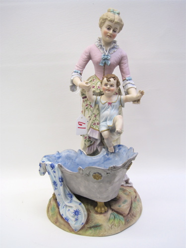 Appraisal: PAINTED BISQUE PORCELAIN FIGURE mother and child at bath time