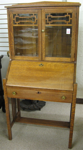 Appraisal: ARTS CRAFTS OAK SECRETARY BOOKCASE American c The slant-front writing