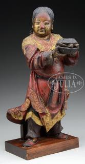 Appraisal: ORIENTAL CARVED FIGURE th th Century A carved figure of