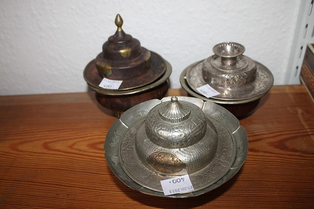 Appraisal: TWO SILVER AND WOOD TIBETAN TEA BOWLS and one matching