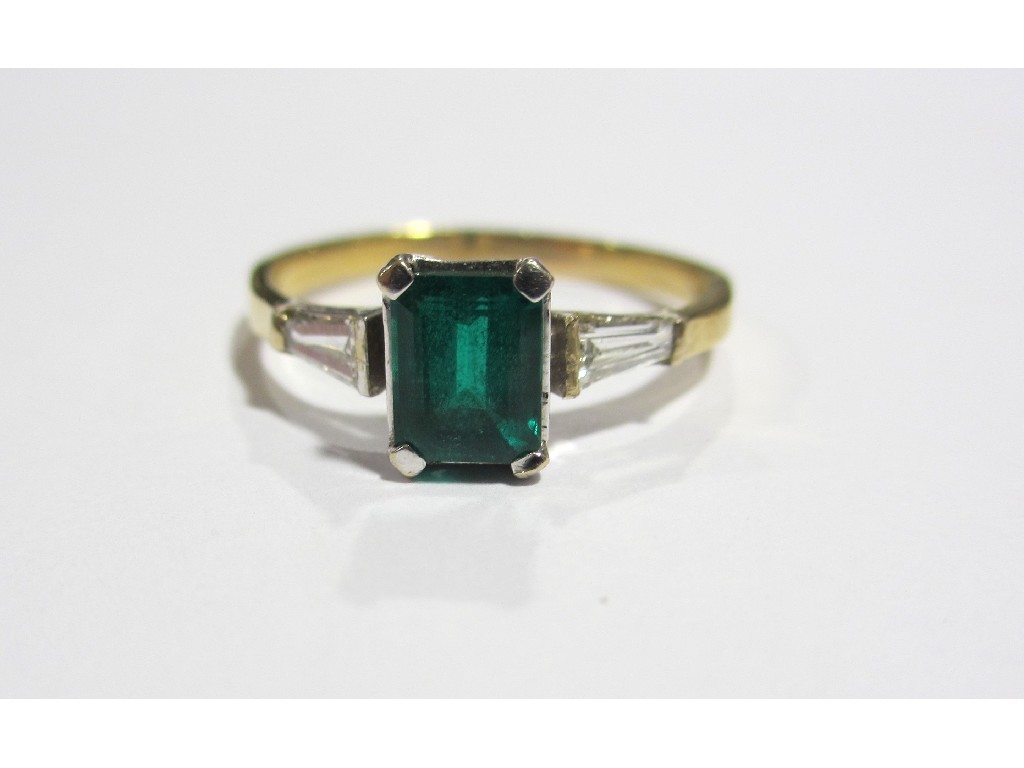 Appraisal: Eighteen carat gold emerald and diamond three stone ring with