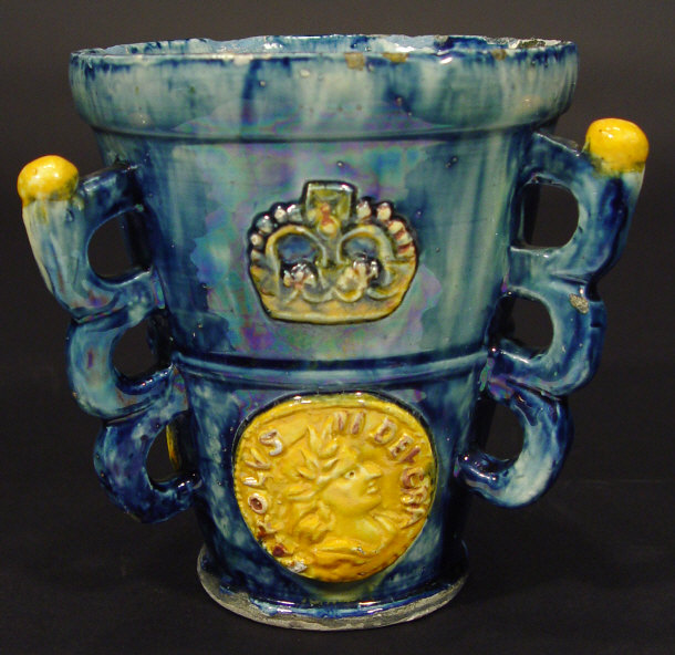 Appraisal: Creamware beaker with three loop handles relief moulded with armorial