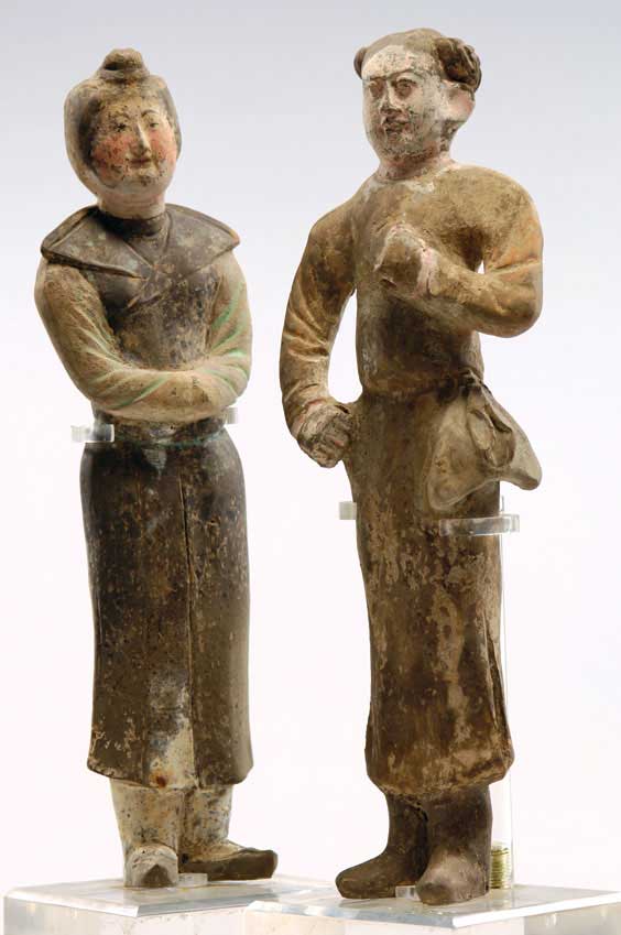 Appraisal: RARE PAIR TANG POTTERY FIGURES Pair of rare Chinese early