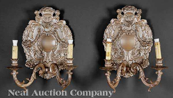 Appraisal: A Set of Four Continental Silvered Bronze Two-Light Wall Sconces