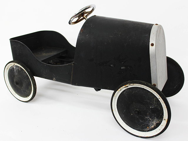 Appraisal: A BLACK PAINTED PEDAL CAR cm long together with an