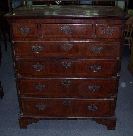 Appraisal: An th Century walnut chest fitted three short and four