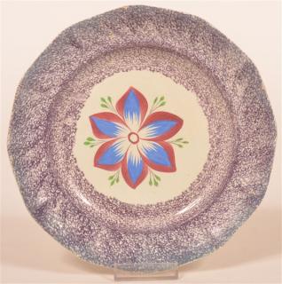 Appraisal: Purple Spatter Dahlia Pattern Paneled Plate Purple Spatter Ironstone China