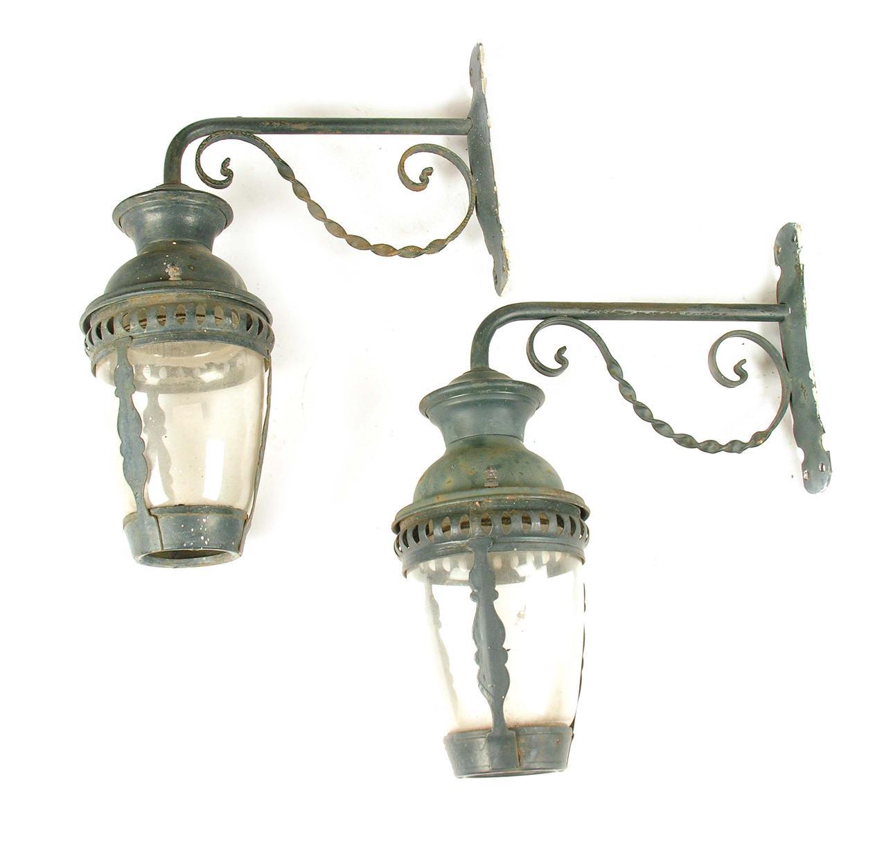 Appraisal: A pair of painted metal and glass wall lanterns