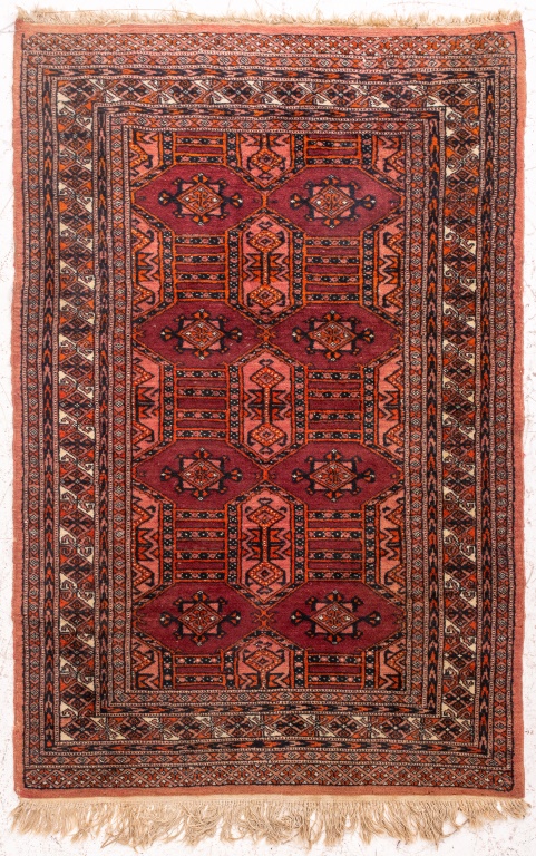 Appraisal: TURKMAN HANDKNOTTED PLUM WOOL RUG Turkman hand-knotted geometric pattern wool