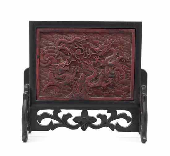 Appraisal: A Chinese Carved Wood Table Screen having a red pigment