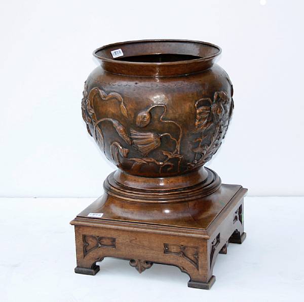 Appraisal: A large copper jardini re on wood plinth Repouss with