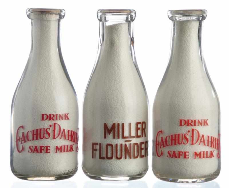 Appraisal: Lot of Pennsylvania Milk Bottles Description Lot includes two bottles