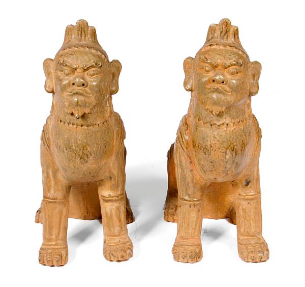 Appraisal: A pair of Chinese earthenware figures of mythical beasts height