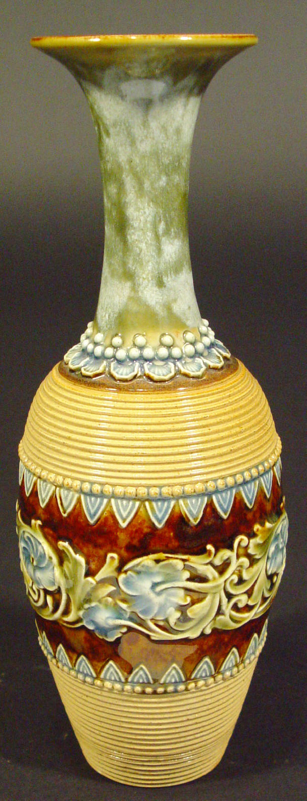 Appraisal: Doulton Lambeth stoneware bottle vase relief moulded with a continuous