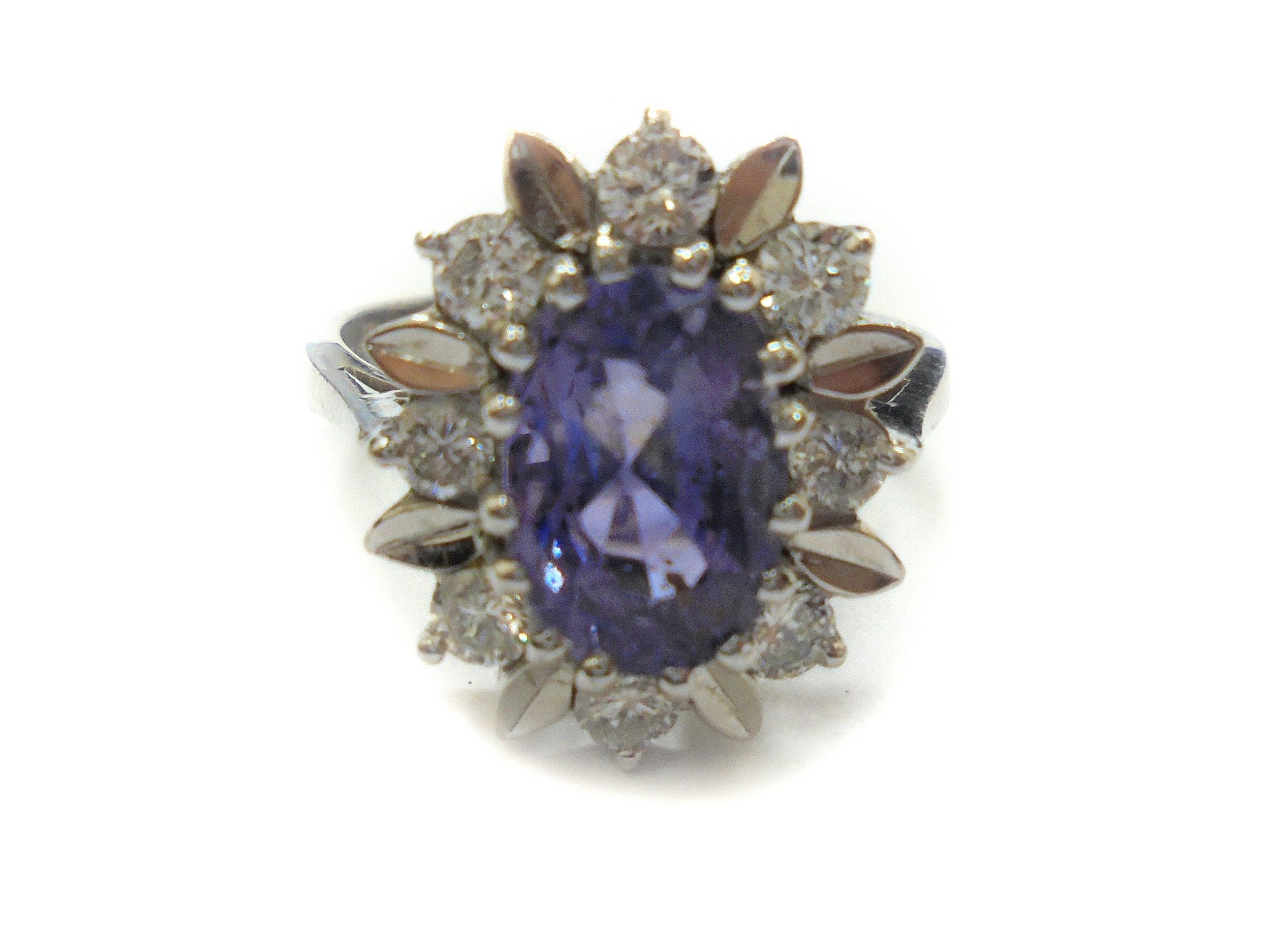 Appraisal: A modern ct white gold sapphire and diamond oval cluster