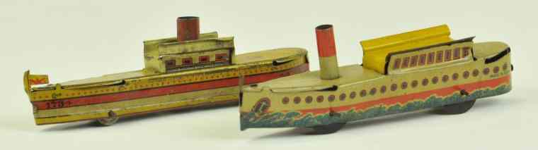 Appraisal: TWO RIVER BOAT PENNY TOYS Germany both lithographed tin includes