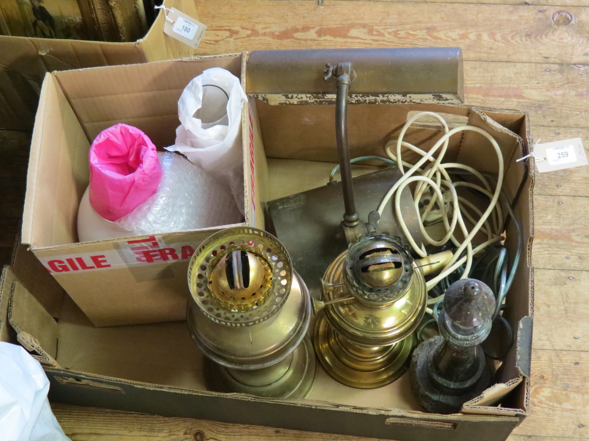 Appraisal: A serpentine 'lighthouse' table lamp pair of brass oil lamps