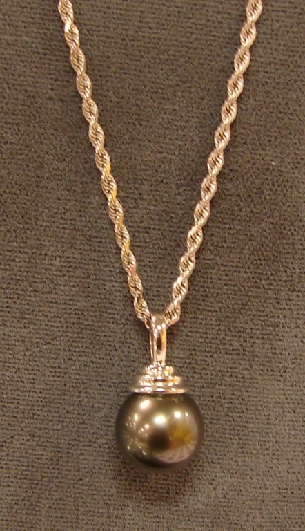 Appraisal: Necklace contains one mm pearl on chain S