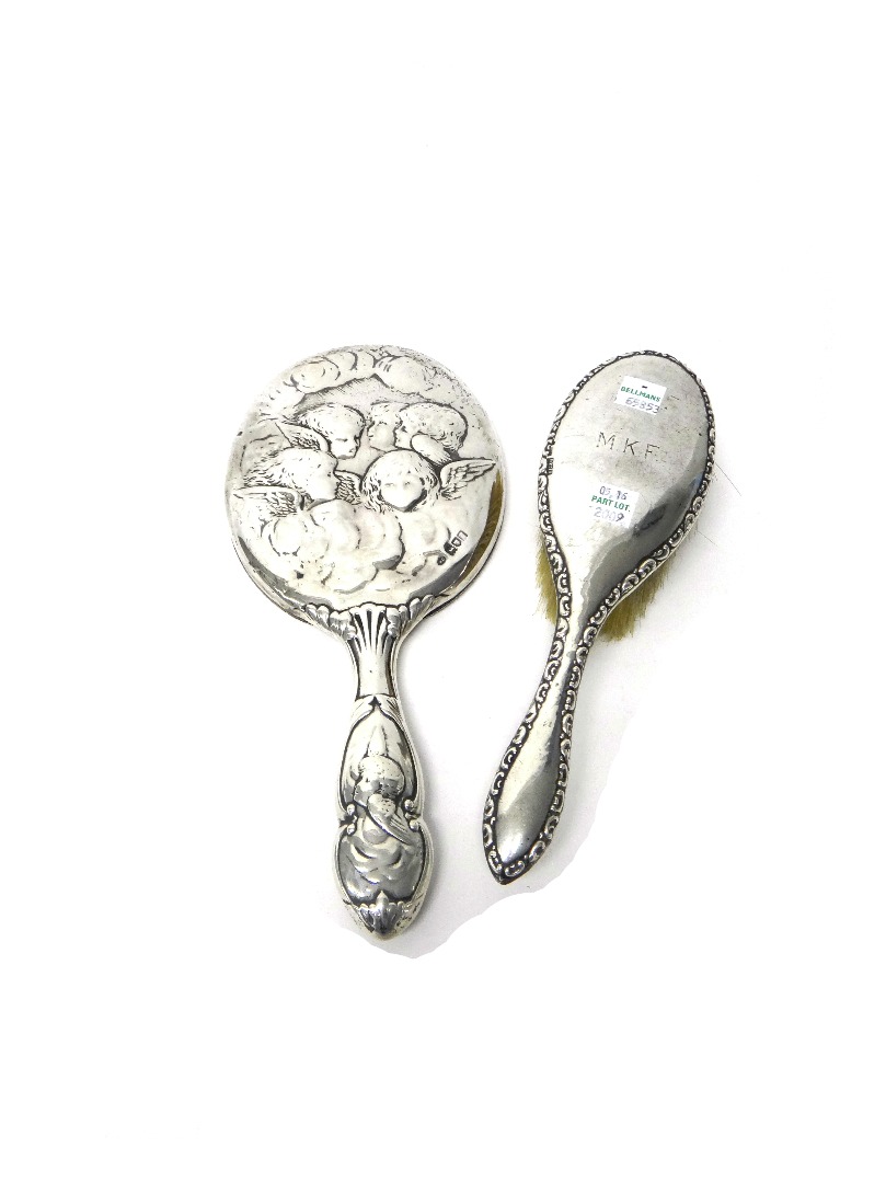 Appraisal: A late Victorian lady's silver mounted oval hand mirror embossed