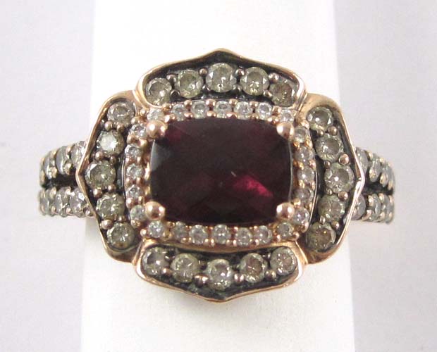 Appraisal: RHODOLITE GARNET AND DIAMOND RING The k gold ring features