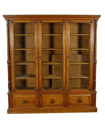 Appraisal: A Victorian oak bookcase by Wilkinson Son the moulded cavetto