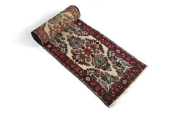 Appraisal: ORIENTAL RUNNER Dergazine Red border with a floral design on