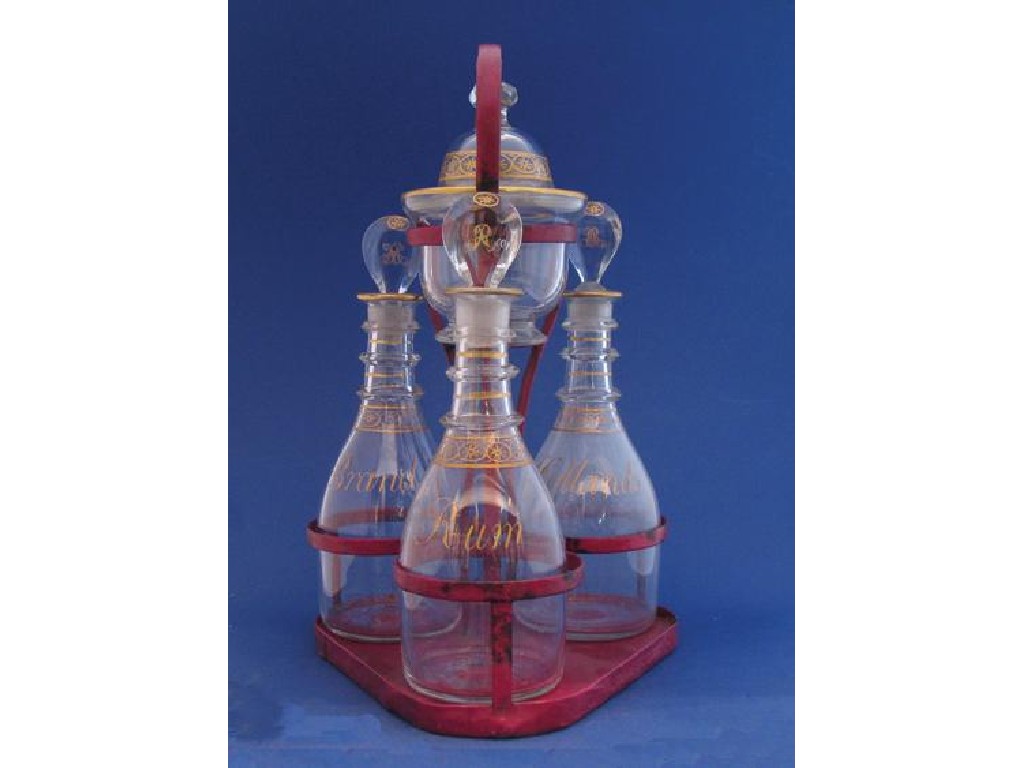 Appraisal: A REGENCY DECANTER SET comprising three gilt decorated clear glass