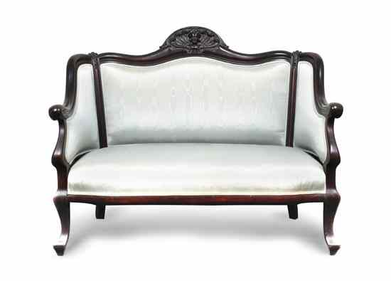 Appraisal: An Empire Revival Settee the crest rail centered with a