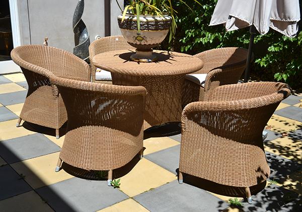 Appraisal: A SIX PIECE CANE OUTDOOR SETTING INCLUDING FIVE CHAIRS AND