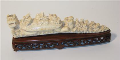 Appraisal: Chinese elephant or mammoth ivory tusk carving Of long slightly