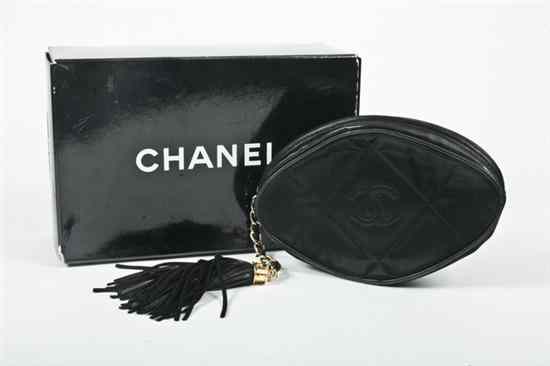 Appraisal: CHANEL BLACK QUILTED SATIN EVENING CLUTCH Oval one side with