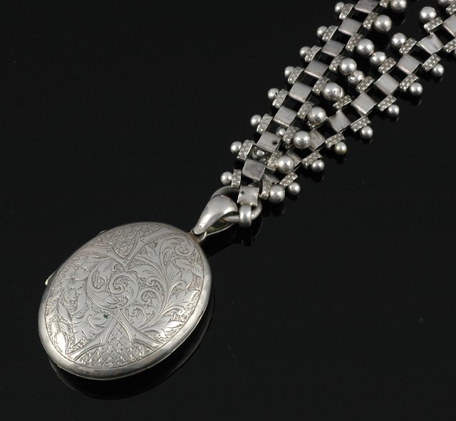 Appraisal: AN ANTIQUE SILVER LOCKET AND COLLAR The oval hinged locket