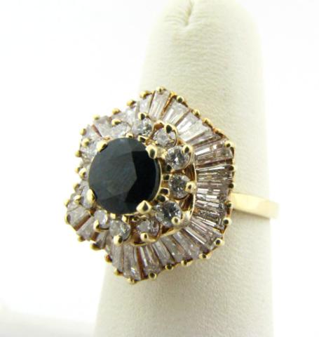 Appraisal: K yellow gold sapphire and diamond ballerina ring with approximately