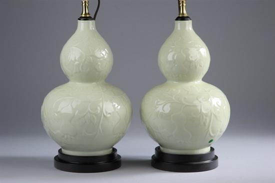 Appraisal: PAIR CHINESE YELLOW-BEIGE PORCELAIN DOUBLE-GOURD VASES Floral decoration electrified -