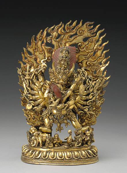 Appraisal: A large Nepalese gilt bronze Vajrabhairava-Vajravateli group The buffalo headed