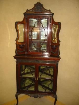 Appraisal: A VICTORIAN CARVED MAHOGANY CORNER DISPLAY CABINET in the Rococo