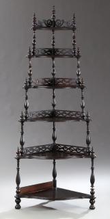 Appraisal: American Victorian Carved Mahogany Corner Etagere c six cascading bombe