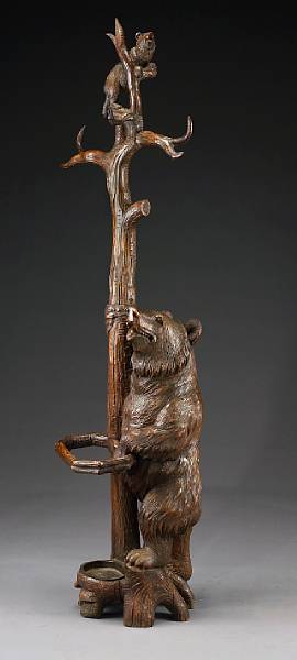 Appraisal: A Black Forest carved lindenwood bear hall stand last quarter