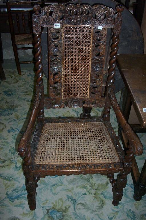 Appraisal: An th century walnut armchair with extensively carved and pierced