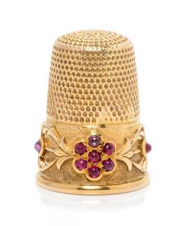 Appraisal: A Continental Yellow Gold and Ruby Thimble the knurled top