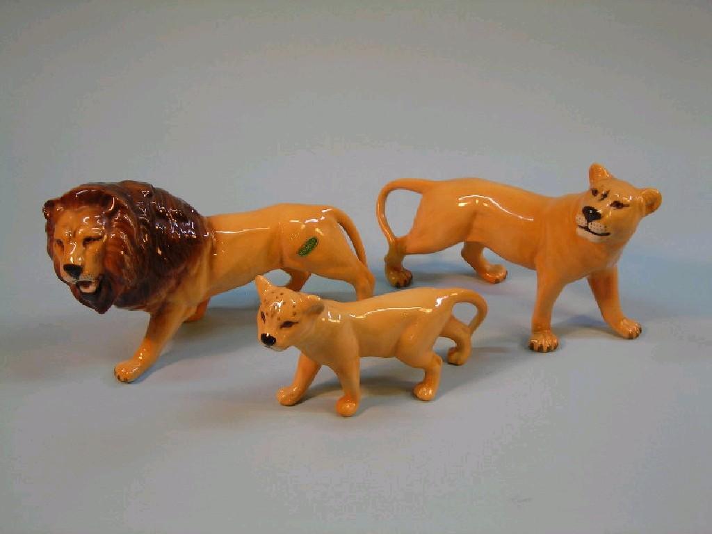 Appraisal: Beswick A lion cub a lioness and a lion